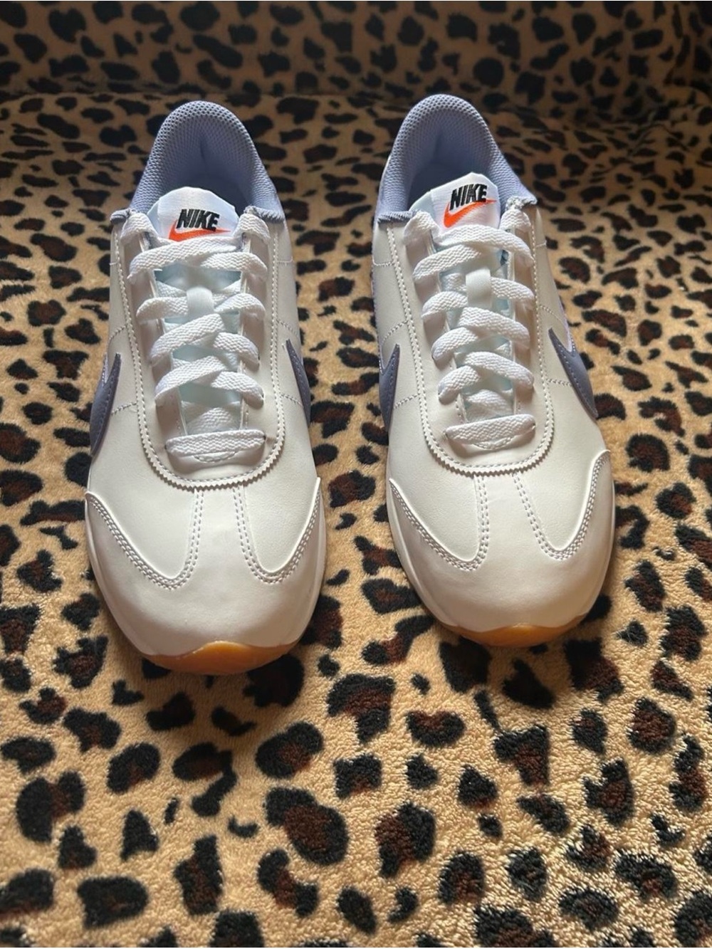 Classic Nike Cortez sneakers in white with light blue Swoosh detailing size 8.5